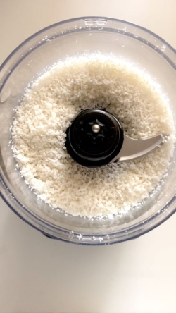 Pulse coconut in a food processor until crumbs form. Set aside about 1 tbsp of the mixture.