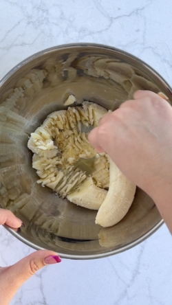Mash bananas in a bowl