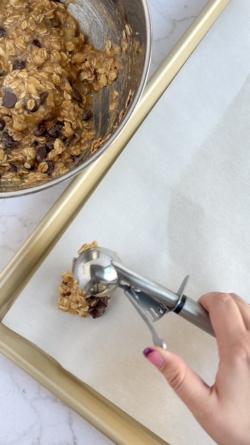 Use a cookie scoop to measure cookie portions and place them on a parchment lined baking sheet about 2-2.5” apart