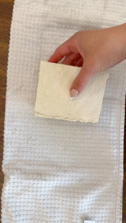 Take tofu out of the package and wrap in a clean, dry towel. Place something heavy like cookbooks on top for 15 minutes. This is referred to as “pressing the tofu” and is a method used to draw out extra moisture as most packaged tofu comes submerged in liquid.