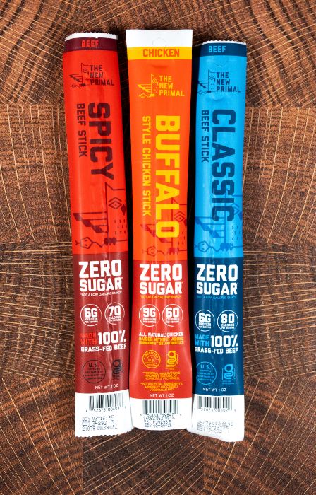 Three flavors of The New Primal meat stick snacks.