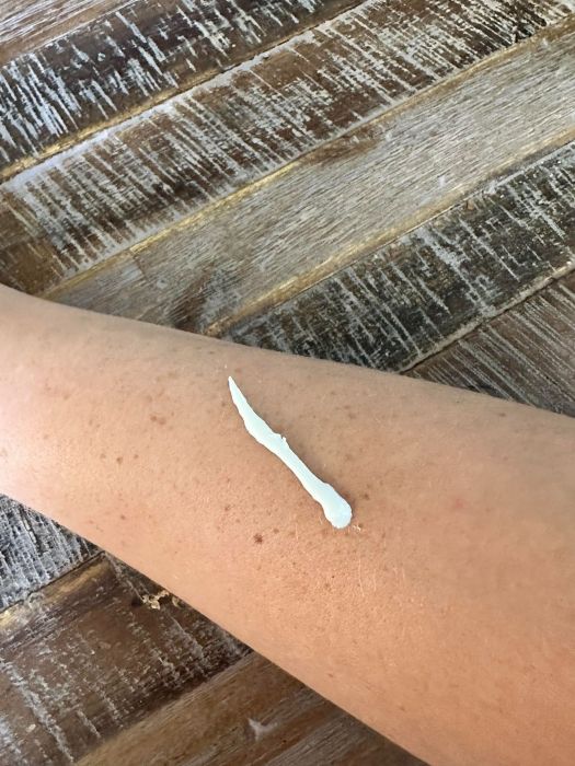 Image of Supergoop! PLAY 100% Mineral Lotion Sunscreen on an arm that has not been rubbed in.