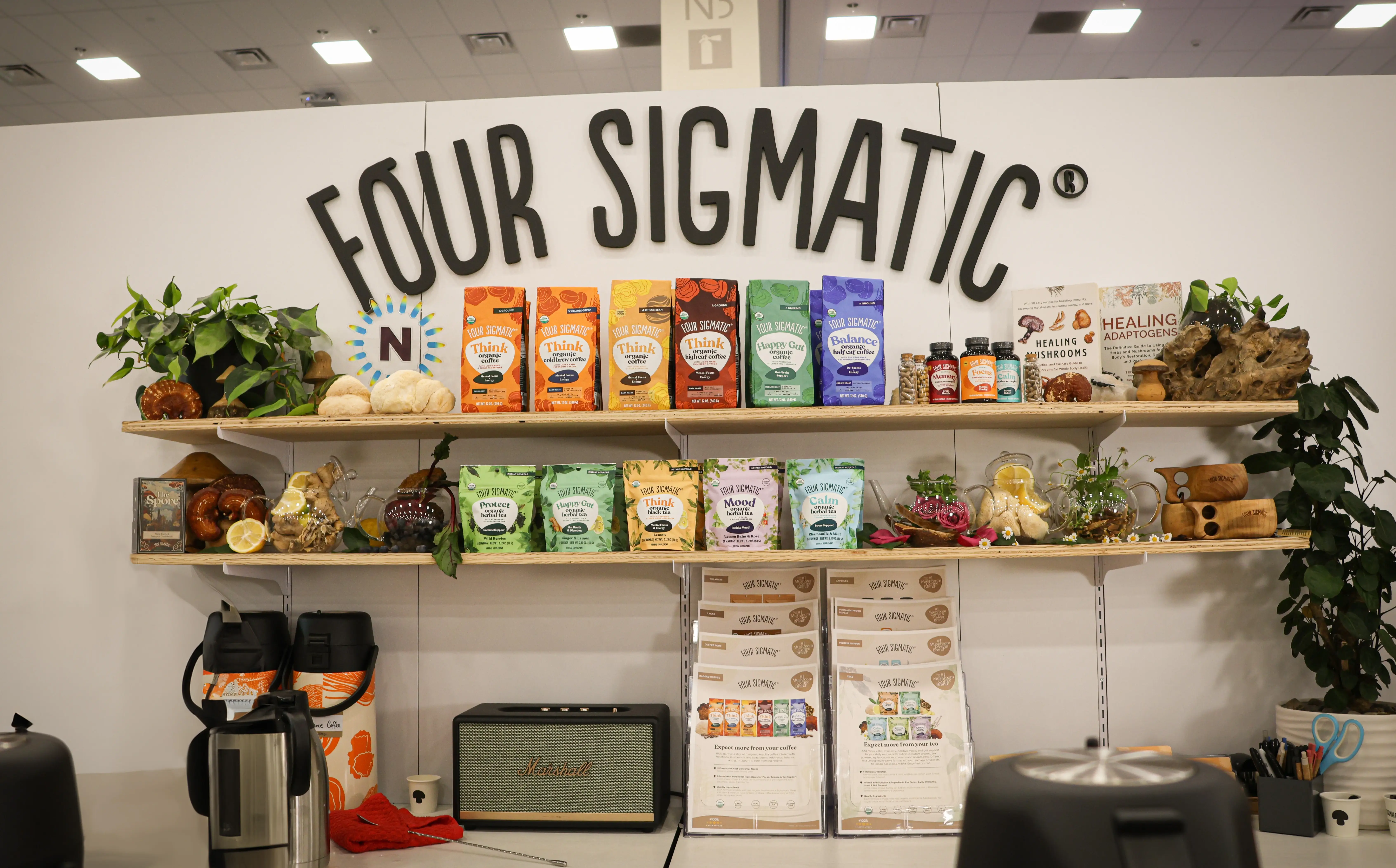 Four Sigmatic Expo West booth with products on shelves